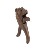BLACK FOREST' CARVED AND STAINED SOFTWOOD NUTCRACKER MODELLED WITH A LION'S HEAD