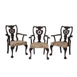 SET OF SIX CARVED MAHOGANY AND UPHOLSTERED ELBOW CHAIRS IN CHIPPENDALE STYLE