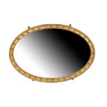 GILTWOOD FRAMED OVAL WALL MIRROR IN REGENCY TASTE