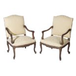 PAIR OF CARVED AND PARCEL GILT BEECH AND UPHOLSTERED CANAPES IN LOUIS XV TASTE