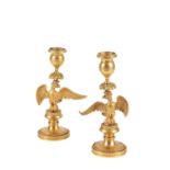 PAIR OF ORMOLU CANDLESTICKS CAST WITH SPREADEAGLES, EMPIRE OR POSSIBLY RUSSIAN