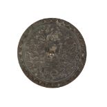 A RELIEF CAST BRONZE ROUNDEL IN THE MANNER OF A PERSIAN SHIELD