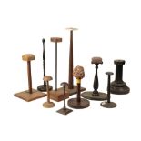 TEN VARIOUS HELMET STANDS