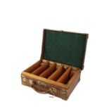 AN EDWARDIAN LEATHER AND OAK CARTRIDGE CASE