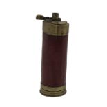 A BRASS AND LEATHER BOUND POWDER FLASK