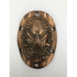 A VICTORIAN BRASS OVAL CANNON PLAQUE