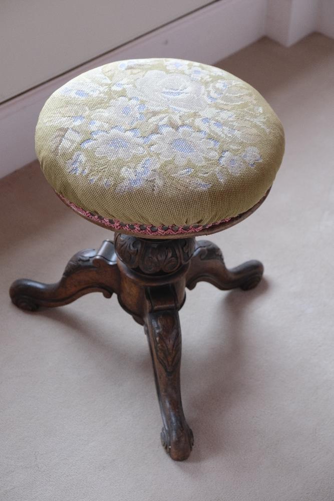 A VICTORIAN WALNUT MUSIC STOOL