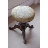 A VICTORIAN WALNUT MUSIC STOOL