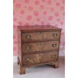 A GEORGE II STYLE MAHOGANY CHEST OF DRAWERS