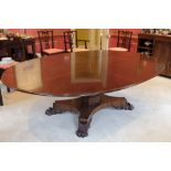 A REGENCY STYLE MAHOGANY DINING TABLE BY MARTIN DODGE