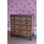 A GEORGE II STYLE WALNUT CHEST OF DRAWERS