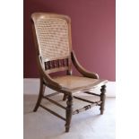 A VICTORIAN CANED NURSING CHAIR