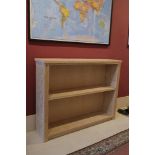 A LIMED OAK BOOKCASE