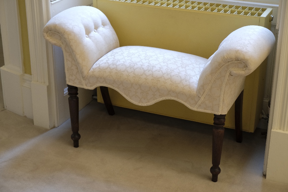 A LATE GEORGE III STYLE MAHOGANY WINDOW SEAT