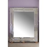 A LARGE VENETIAN STYLE MIRROR