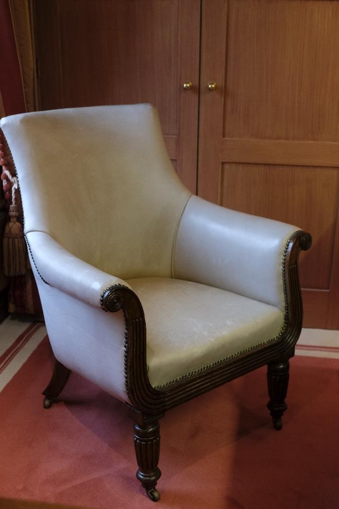 A REGENCY MAHOGANY LEATHER BERGERE ARMCHAIR