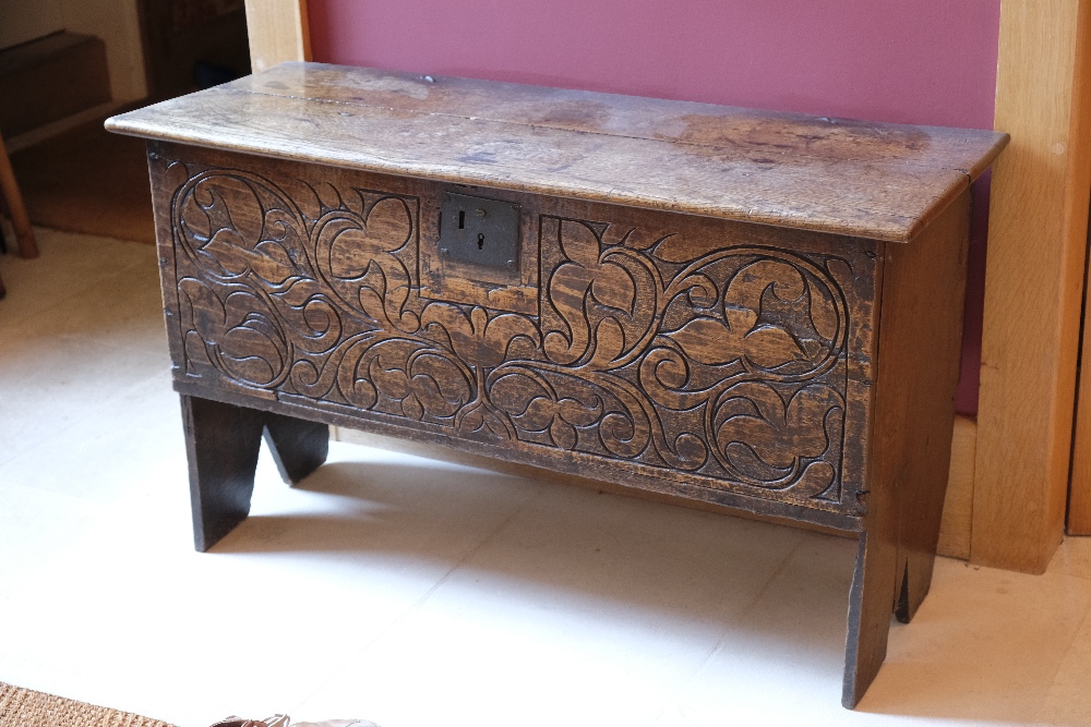 A CHARLES II OAK BOARDED COFFER