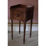 A MATCHED PAIR OF LATE REGENCY STYLE MAHOGANY BEDSIDE TABLES