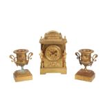 A VICTORIAN FRENCH BRASS CASED MANTEL CLOCK AND GARNITURE