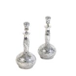A PAIR OF EARLY 20TH CENTURY GLASS BOTTLES,