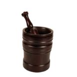 A TURNED LIGNUM VITAE MORTAR AND PESTLE,