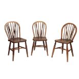 AN ASSOCIATED GROUP OF NINE ASH AND ELM SPINDLE BACK CHAIRS,