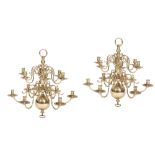 A MATCHED PAIR OF DUTCH BRASS TWELVE LIGHT CHANDELIERS,