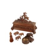 A 'BLACK FOREST' CARVED AND STAINED LINDEN WOOD BOX AND A CACHE POT WITH A BEAR