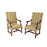 A PAIR OF CARVED WALNUT AND UPHOLSTERED OPEN ARMCHAIRS IN FRANCO-FLEMISH EARLY 18TH CENTURY STYLE,