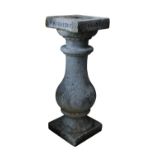 A GRANITE BALUSTER PEDESTAL,