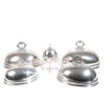 A GRADUATED SET OF THREE SILVER PLATED COPPER DOME FOOD COVERS