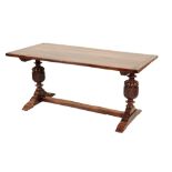 AN OAK TRESTLE TABLE IN ELIZABETHAN STYLE,