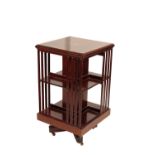 AN EDWARDIAN MAHOGANY REVOLVING BOOKCASE,