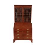 A MAHOGANY AND GLAZED BUREAU BOOKCASE IN GEORGE III STYLE,