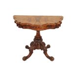 A VICTORIAN FIGURED WALNUT FOLDING CARD TABLE,