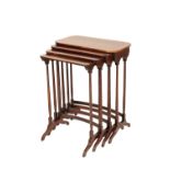 A NEST OF FOUR ROSEWOOD AND CROSSBANDED QUARTETTO TABLES,