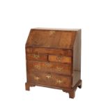 A GEORGE II WALNUT BUREAU,