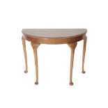 A BURR WALNUT AND FEATHER BANDED DEMI-LUNE SIDE TABLE IN GEORGE II STYLE,