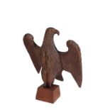 A CARVED WALNUT MODEL OF AN EAGLE,