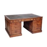 A VICTORIAN WALNUT AND LEATHER INSET PARTNERS DESK,