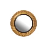 A REGENCY GILTWOOD FRAMED CONVEX WALL MIRROR,