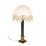 A GILT METAL TABLE LAMP IN BAROQUE STYLE,