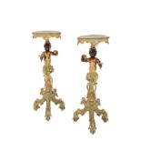 A PAIR OF VENETIAN CARVED, PAINTED AND PARCEL GILTWOOD FIGURAL TORCHERE STANDS,