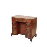 A GEORGE III MAHOGANY KNEEHOLE DESK,