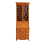 A SATINWOOD AND GLAZED BUREAU BOOKCASE IN SHERATON STYLE,