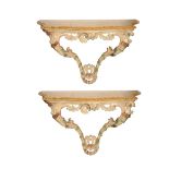 A PAIR OF ITALIAN CARVED AND PAINTED SOFTWOOD AND MARBLE MOUNTED CONSOLE TABLES,