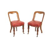 A SET OF FOUR GEORGE IV OR WILLIAM IV OAK AND UPHOLSTERED SIDE CHAIRS,