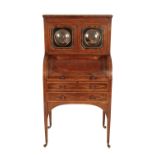 A GEORGE IV ROSEWOOD, AMBOYNA, AND SATINWOOD STRUNG CYLINDER SECRETAIRE,
