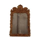 A DUTCH ROCOCO GILT GESSO MIRROR