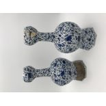 A PAIR OF DUTCH DELFTWARE BLUE AND WHITE VASES,